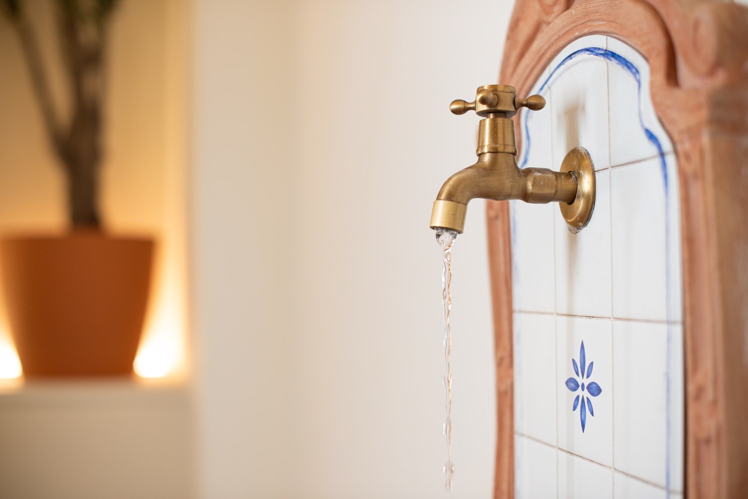 Terracotta fountain with hand-painted tile and brass tap, Alma House